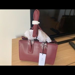 Matt and nat , deep cherry bag